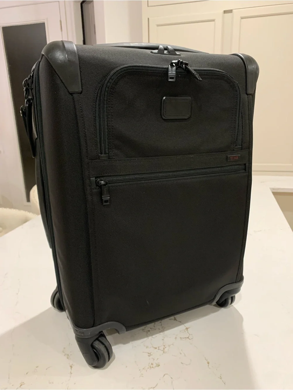 Tumi Black Spinner Carry-On with Front Zip Pocket luggage